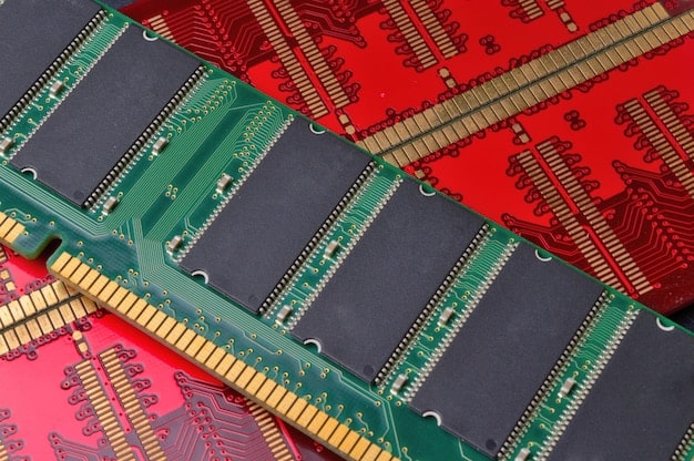 A close-up of various PC components laid out on a workbench, including a CPU, GPU, RAM sticks, and a motherboard. Focus is on the intricate details and labels on each component.