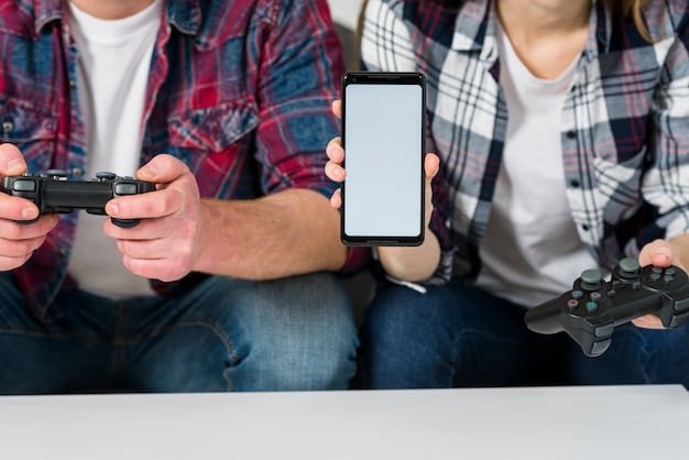 A gamer using their smartphone, with a portable charger connected. The game on the screen is visually detailed, but the phone's battery indicator shows it's charging. The background is a casual gaming setup.