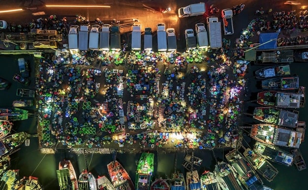 A panoramic view of a large arena filled with spectators watching a PUBG Mobile tournament on a giant screen. The stage is set up with gaming stations, and commentators are broadcasting the event live.