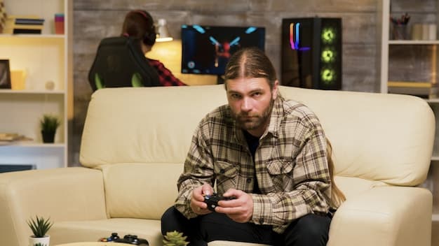 A gamer sitting on a couch, surrounded by multiple screens displaying games, downloading a game digitally.
